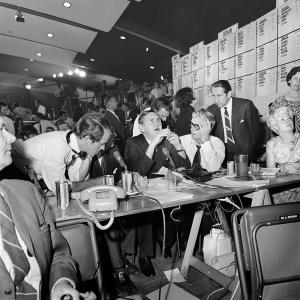 A future prime minister seated at a table with colleagues.