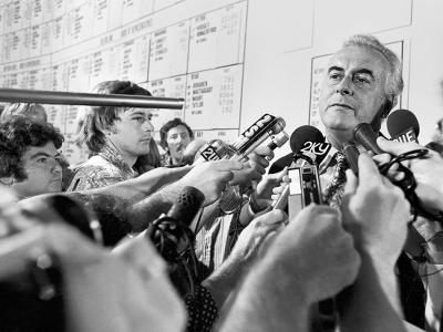 Gough Whitlam cornered in the tally room by microphone wielding reporters.