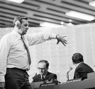 A floor manager counting down before a television broadcast.