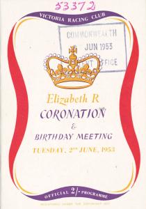 Program featuring a gold crown and a red and purple ribbon.