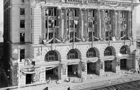 The tall facade of Perth GPO covered with decorations.