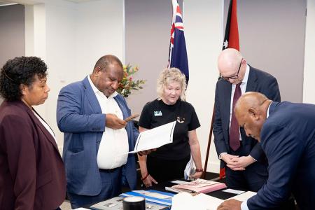 Mrs Rachael Marape, Prime Minister James Marape, Gina Grey, Simon Froude and another person viewing records
