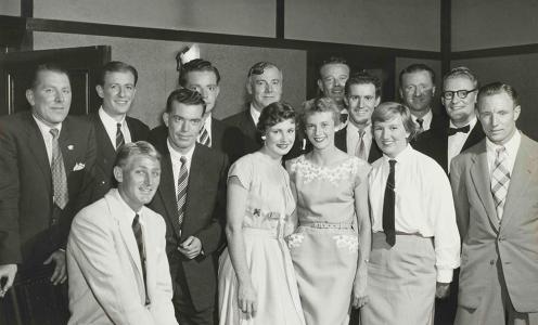 14 people pose for a photograph