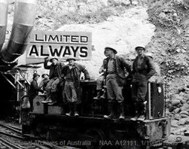 Tunnel workers representing a dozen different nations, but working for Australia, pose before going on shift in the Tooma-Tumut tunnel. At right is Italian born Romolo Fubelli, 27, who is a job representative of the Australian Workers Union. He is a pump attendant in the tunnel