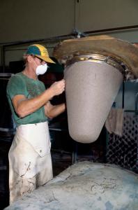 A man removing felt from a form
