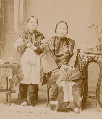 Studio portrait of Mrs Lih Moon and her daughter.