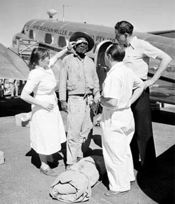 Health - Royal flying doctor service - Flying Doctor examines an Aboriginal stockman