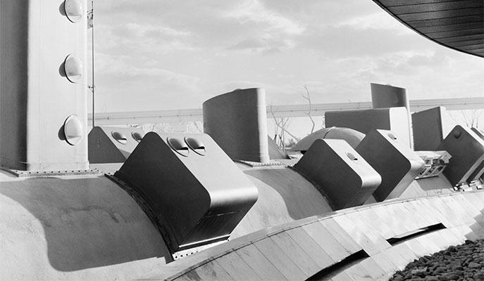 Exterior of pavilion structure showing projecting geometric forms.