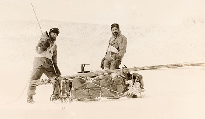 2 men with a sled