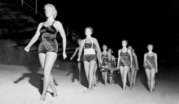 Surf lifesavers marching on Narrabeen beach